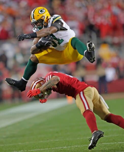 Executive hails Packers rise and questions 49ers future 2 Green Bay Packers running back Emanuel Wilson hurdles San Francisco 49ers linebacker Dre Greenlaw in the fourth quarter during their NFC divisional playoff football game Saturday, January 20, 2024, at Levi's Stadium in Santa Clara, California.
