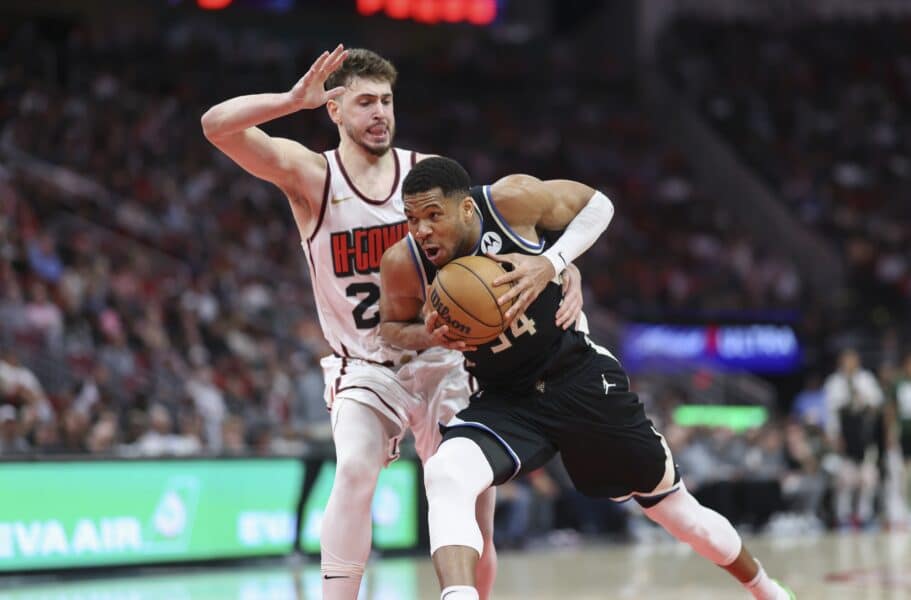 Feb 25, 2025; Houston, Texas, USA; Milwaukee Bucks forward Giannis Antetokounmpo (34) drives with the ball as Houston Rockets center Alperen Sengun (28) defends during the fourth quarter at Toyota Center. Mandatory Credit: Troy Taormina-Imagn Images