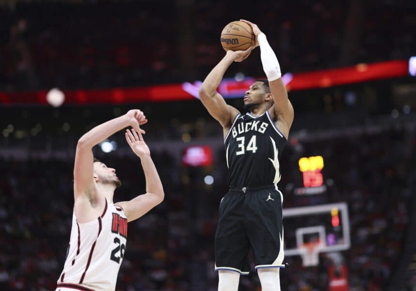 Feb 25, 2025; Houston, Texas, USA; Milwaukee Bucks forward Giannis Antetokounmpo (34) shoots the ball as Houston Rockets center Alperen Sengun (28) defends during the third quarter at Toyota Center. Mandatory Credit: Troy Taormina-Imagn Images