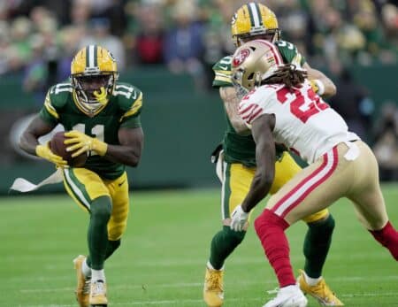 Green Bay Packers wide receiver Jayden Reed (11) makes a reception for a first down during the first quarter of their game against the San Francisco 49ers Sunday, November 24, 2024 at Lambeau Field in Green Bay, Wisconsin.