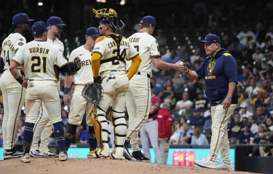Aug 27, 2025; Milwaukee, Wisconsin, USA; Milwaukee Brewers manager Pat Murphy (49) takes Milwaukee Brewers pitcher Erick Fedde (59) out of the game against the Arizona Diamondbacks in the seventh at American Family Field. Mandatory Credit: Michael McLoone-Imagn Images