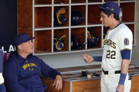 Mar 16, 2024; Phoenix, Arizona, USA; Milwaukee Brewers manager Pat Murphy talks to Christian Yelich (22) before a game against the Texas Rangers at American Family Fields of Phoenix. Mandatory Credit: Rick Scuteri-Imagn Images