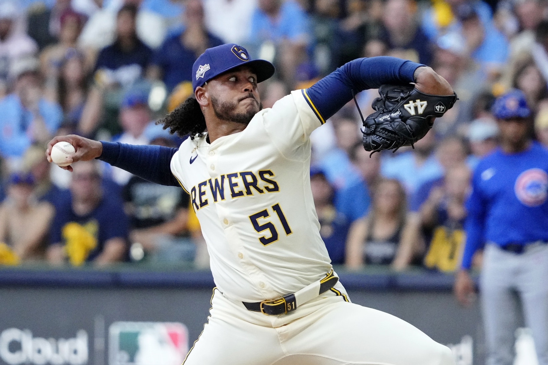 Oct 4, 2025; Milwaukee, Wisconsin, USA; Milwaukee Brewers starting pitcher Freddy Peralta (51) pitches against the Chicago Cubs during the second inning of game one of the NLDS round for the 2025 MLB playoffs at American Family Field. Mandatory Credit: Michael McLoone-Imagn Images