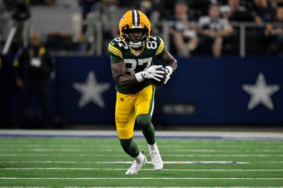 Sep 28, 2025; Arlington, Texas, USA; Green Bay Packers wide receiver Romeo Doubs (87) runs with the ball during the game between the Dallas Cowboys and the Green Bay Packers at AT&T Stadium. Mandatory Credit: Jerome Miron-Imagn Images