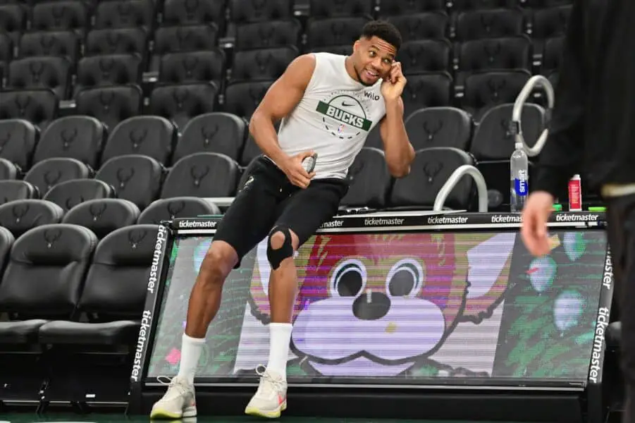 Giannis Antetokounmpo’s playfully asks if he can suit up for college team Nov 1, 2025; Milwaukee, Wisconsin, USA; Milwaukee Bucks forward Giannis Antetokounmpo (34) sits on the scorers table during warmups before game against the Sacramento Kings at Fiserv Forum. Mandatory Credit: Benny Sieu-Imagn Images