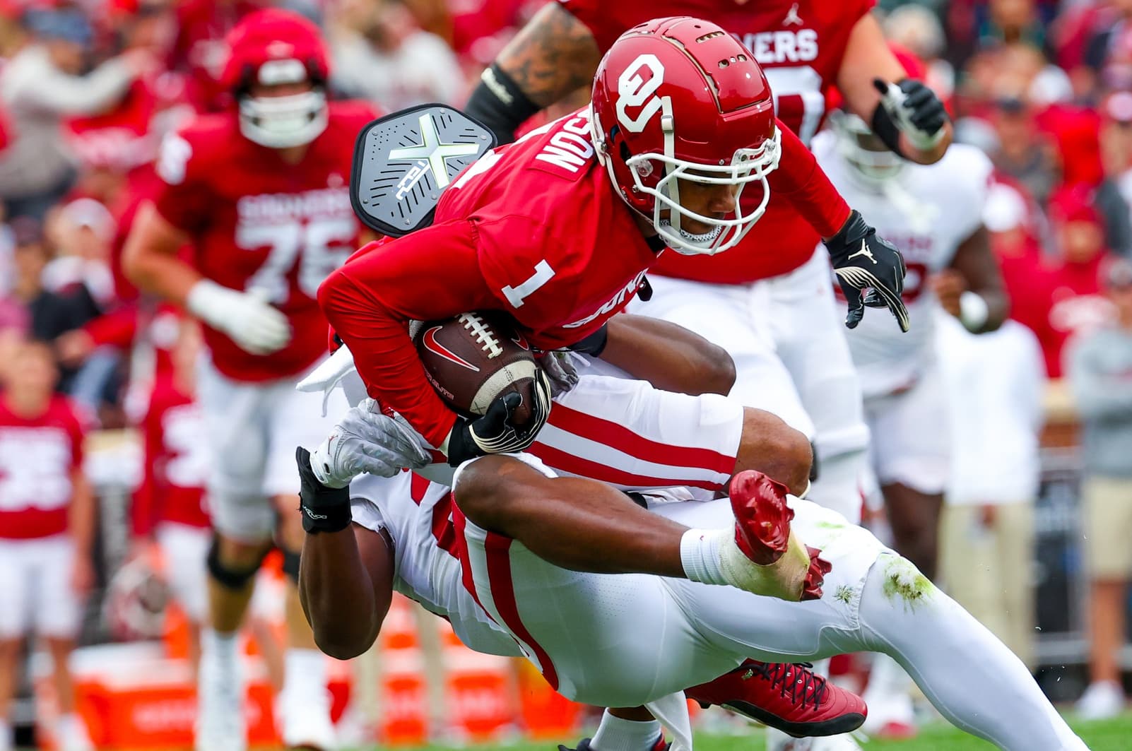 Badgers Odds Sky Rocket To Land Highly Touted SEC Wide Receiver 2 Apr 20, 2024; Norman, OK, USA; Oklahoma Sooners linebacker Samuel Omosigho (24) tackles Oklahoma Sooners wide receiver Jayden Gibson (1) during the Oklahoma Sooners spring game at Gaylord Family OK Memorial Stadium. Mandatory Credit: Kevin Jairaj-Imagn Images