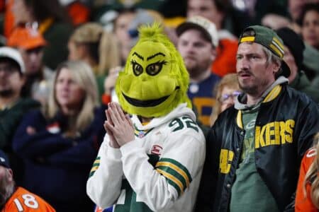 Packers’ Mile High City fail ends up in historic Broncos feat A Green Bay Packers fan dressed as the Grinch