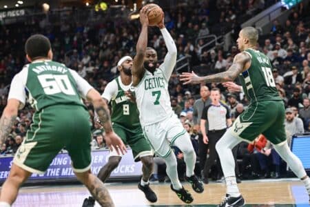 Bucks make NBA history in win over Celtics Dec 11, 2025; Milwaukee, Wisconsin, USA; Boston Celtics forward Jaylen Brown (7) drives to the basket between Milwaukee Bucks forward Bobby Portis (9) and forward Kyle Kuzma (18) in the fourth quarter at Fiserv Forum. Mandatory Credit: Benny Sieu-Imagn Images