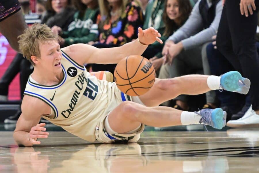 Nov 29, 2025; Milwaukee, Wisconsin, USA; Milwaukee Bucks guard AJ Green (20) falls after a foul in the third quarter against the Brooklyn Nets at Fiserv Forum. Mandatory Credit: Benny Sieu-Imagn Images
