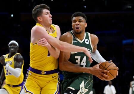 Austin Reaves untouchable unless Giannis Antetokounmpo or Nikola Jokic hits the market Feb 9, 2023; Los Angeles, California, USA; Los Angeles Lakers guard Austin Reaves (15) defends Milwaukee Bucks forward Giannis Antetokounmpo (34) as he drives to the basket in the first half at Crypto.com Arena. Mandatory Credit: Jayne Kamin-Oncea-Imagn Images
