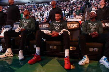 “It was a tough pill to swallow”: Khris Middleton reflects on Bucks post-championship woes Apr 17, 2022; Milwaukee, Wisconsin, USA; Milwaukee Bucks forward Khris Middleton (22), forward Giannis Antetokounmpo (34) and guard Jrue Holiday (21) sit on the bench prior to player introductions prior to game one of the first round for the 2022 NBA playoffs against the Chicago Bullsat Fiserv Forum. Mandatory Credit: Jeff Hanisch-Imagn Images