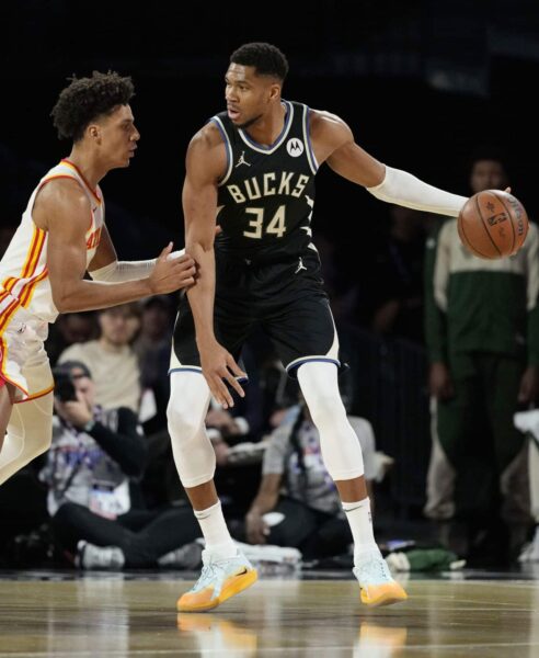 Bucks survive Hawks surge 112-110, after 23 point collapse 2 Dec 14, 2024; Las Vegas, Nevada, USA; Milwaukee Bucks forward Giannis Antetokounmpo (34) controls the ball against Atlanta Hawks forward Jalen Johnson (1) during the first quarter in a semifinal of the 2024 Emirates NBA Cup at T-Mobile Arena. Mandatory Credit: Kyle Terada-Imagn Images