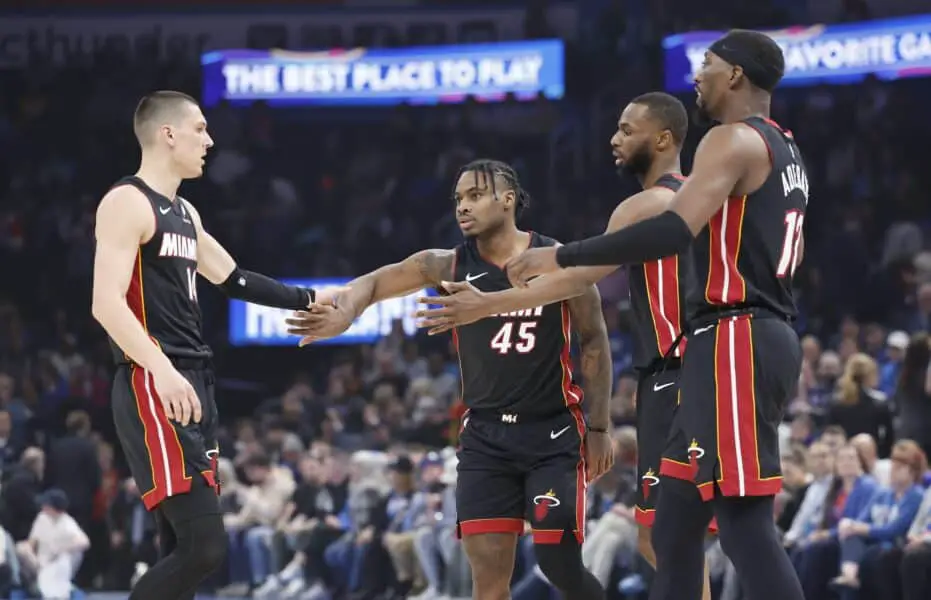 Heat plot big gamble to win Giannis Antetokounmpo sweepstakes 2 Feb 12, 2025; Oklahoma City, Oklahoma, USA; Miami Heat guard Tyler Herro (14), guard Davion Mitchell (45), forward Andrew Wiggins (22) and center Bam Adebayo (13) high five after a play against the Oklahoma City Thunder during the first quarter at Paycom Center. Mandatory Credit: Alonzo Adams-Imagn Images
