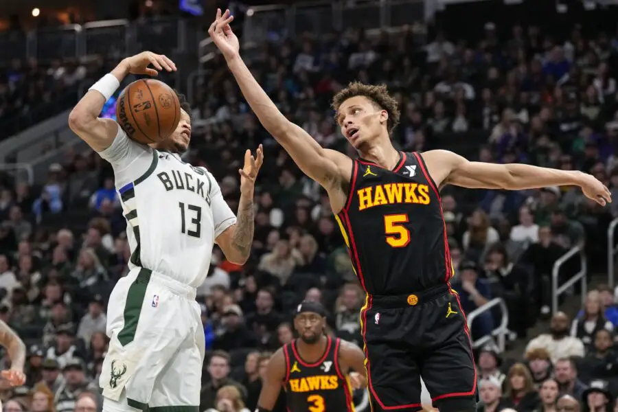 Bucks survive Hawks surge 112-110, after 23 point collapse Mar 30, 2025; Milwaukee, Wisconsin, USA; Atlanta Hawks guard Dyson Daniels (5) and Milwaukee Bucks guard Ryan Rollins (13) reach for the loose ball during the third quarter at Fiserv Forum. Mandatory Credit: Jeff Hanisch-Imagn Images
