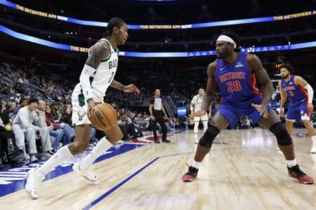 Milwaukee Bucks guard Kevin Porter Jr. (7) dribbles defended by Detroit Pistons forward Isaiah Stewart (28)