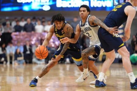 Marquette basketball loses to Villanova in brutal ending Marquette Golden Eagles guard Nigel James Jr (0) drives against Villanova Wildcats guard Bryce Lindsay (2)